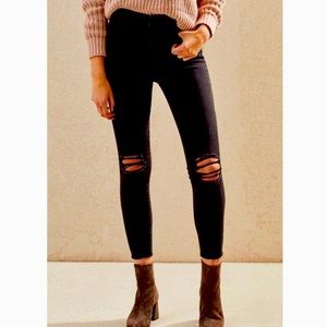 Black ripped knee jeans
